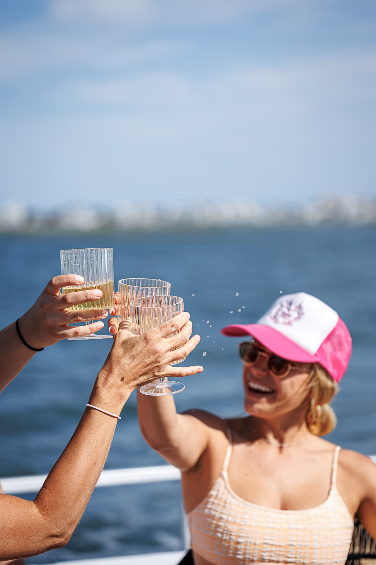 Guests toasting drinks on a Sand Bar Joe's BYOB bachelorette cruise on the Wildwood bay